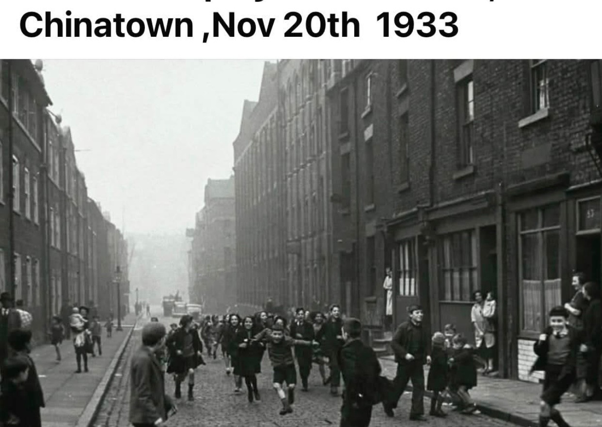 Historic black-and-white street view of Liverpool Chinatown in 1933.